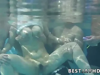 Suzuna Komiya, the nastiest Asian woman, gives fellatio by the pool in the greatest Japanese group fuck-a-thon scene.